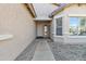 Pathway leading to a covered entrance of a well-maintained single-story home with desert landscaping at 3013 W Pollack St, Phoenix, AZ 85041