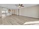 Bright living room with open floor plan, recessed lighting, and wood-look flooring at 3013 W Pollack St, Phoenix, AZ 85041