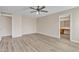 Inviting main bedroom with wood-look floors and ensuite bath featuring a large vanity at 3013 W Pollack St, Phoenix, AZ 85041