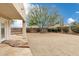 Backyard featuring desert landscaping, gravel, pavers and a covered patio at 30404 N 43Rd St, Cave Creek, AZ 85331