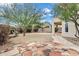 Spacious backyard featuring desert landscaping, mature trees, shrubs and a rock border at 30404 N 43Rd St, Cave Creek, AZ 85331