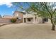 Backyard featuring desert landscaping, decorative rocks and a gravel patio with a large, mature tree at 30404 N 43Rd St, Cave Creek, AZ 85331