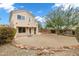 Beautiful backyard with desert landscaping, gravel, mature trees and a small upstairs balcony at 30404 N 43Rd St, Cave Creek, AZ 85331