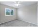 Neutral bedroom featuring a ceiling fan and a large window with lots of natural light at 30404 N 43Rd St, Cave Creek, AZ 85331