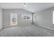 Spacious, carpeted bedroom featuring a ceiling fan, bright windows, and neutral paint at 30404 N 43Rd St, Cave Creek, AZ 85331