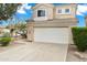 Inviting two-story home with a white garage door, desert landscaping, and a peaceful neighborhood setting at 30404 N 43Rd St, Cave Creek, AZ 85331