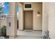 Welcoming front porch with a covered entry and a charming welcome mat, featuring textured walls and a stylish light fixture at 30404 N 43Rd St, Cave Creek, AZ 85331