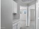 Bright hallway with white cabinetry and gray carpet leads into other rooms at 30404 N 43Rd St, Cave Creek, AZ 85331