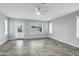 Open living room with tile flooring, a ceiling fan and natural light at 30404 N 43Rd St, Cave Creek, AZ 85331