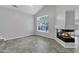 Inviting living room featuring a corner fireplace, tall windows, and modern tile flooring at 30404 N 43Rd St, Cave Creek, AZ 85331