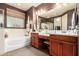 Double sink vanity and soaking tub featured in this bathroom with a walk in closet at 3209 W Spur Dr, Phoenix, AZ 85083