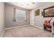 Neutral bedroom offering a ceiling fan and a light-filled window with blinds at 3209 W Spur Dr, Phoenix, AZ 85083