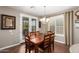 Elegant dining area with a stylish chandelier and french doors to the outdoor space at 3209 W Spur Dr, Phoenix, AZ 85083