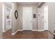 Welcoming foyer with hardwood floors and a white front door, creating a warm ambiance at 3209 W Spur Dr, Phoenix, AZ 85083