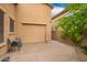 View of the exterior garage door and side yard with pavers at 3209 W Spur Dr, Phoenix, AZ 85083