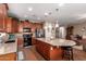 Modern kitchen with stainless steel appliances, granite countertops and beautiful wood cabinetry at 3209 W Spur Dr, Phoenix, AZ 85083