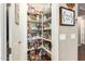 Walk-in pantry with ample shelving for food storage and organization, kept in excellent condition at 3209 W Spur Dr, Phoenix, AZ 85083