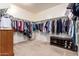 Spacious walk-in closet with ample hanging space and built-in shoe storage at 3209 W Spur Dr, Phoenix, AZ 85083