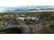 Aerial view of the community clubhouse, beautiful desert landscaping, and desert mountain views at 34463 N 99Th Way, Scottsdale, AZ 85262