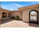 Charming courtyard with brick paving, iron gate, and fountain at 34463 N 99Th Way, Scottsdale, AZ 85262