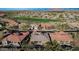 Aerial view of a lovely home near the desert community golf course with desert landscaping at 34463 N 99Th Way, Scottsdale, AZ 85262