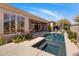 Inviting pool area with a patio, desert landscaping, and home exterior at 34463 N 99Th Way, Scottsdale, AZ 85262