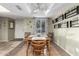 Dining area features a classic wood table, stylish décor, and natural light from the window at 3535 W Monte Cristo Ave # 115, Phoenix, AZ 85053