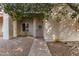 Inviting front entrance features a security door, decorative wreath, and neutral-toned exterior at 3535 W Monte Cristo Ave # 115, Phoenix, AZ 85053