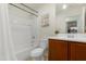 Bright bathroom featuring a shower-tub combo, vanity with sink and a mirror at 40142 W Coltin Way, Maricopa, AZ 85138