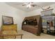 Stylish bedroom with a unique tented bed and comfortable chair at 40142 W Coltin Way, Maricopa, AZ 85138