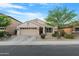 Attractive single-story home featuring a well-kept lawn and inviting facade at 40142 W Coltin Way, Maricopa, AZ 85138