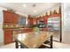 Well-lit kitchen features stainless appliances and granite countertops at 40142 W Coltin Way, Maricopa, AZ 85138