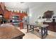 Stylish kitchen with stainless steel appliances and rich wood cabinetry at 40142 W Coltin Way, Maricopa, AZ 85138