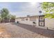 Low-maintenance backyard with desert landscaping features a gravel ground cover, patio space, and block wall fencing at 4126 E Carmel Ave, Mesa, AZ 85206