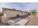 Spacious backyard with desert landscaping features a large gravel ground cover and privacy block wall fencing at 4126 E Carmel Ave, Mesa, AZ 85206