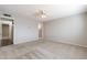 Spacious bedroom featuring neutral carpet, paint, and ceiling fan, offering a calming retreat at 4126 E Carmel Ave, Mesa, AZ 85206