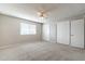 Comfortable bedroom with carpet floors, lots of natural light, and a sizable closet space at 4126 E Carmel Ave, Mesa, AZ 85206