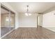 Bright dining room with sliding glass doors, neutral walls, and a view to the hallway at 4126 E Carmel Ave, Mesa, AZ 85206