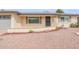 Cozy home exterior boasting easy landscaping, neutral exterior paint and shuttered windows at 4126 E Carmel Ave, Mesa, AZ 85206