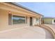 Welcoming front porch features neutral walls, a gray trimmed window, and ample outdoor space at 4126 E Carmel Ave, Mesa, AZ 85206