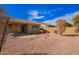 Expansive backyard showcasing desert landscaping, privacy wall, and an inviting outdoor space at 41304 W Rio Bravo Dr, Maricopa, AZ 85138