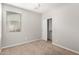 Bedroom with carpet, a window, and a closet at 41304 W Rio Bravo Dr, Maricopa, AZ 85138