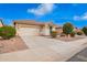 Charming single-story home featuring a two-car garage and low maintenance desert landscaping at 41304 W Rio Bravo Dr, Maricopa, AZ 85138