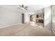 Bright living room featuring neutral walls and carpeted floors at 41304 W Rio Bravo Dr, Maricopa, AZ 85138