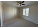 Bedroom with a ceiling fan and a sunlit window at 4200 N Miller Rd # 321, Scottsdale, AZ 85251