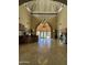 Grand lobby entrance with high ceilings, a chandelier, and tiled floors at luxury condominiums at 4200 N Miller Rd # 321, Scottsdale, AZ 85251