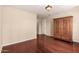 Bedroom featuring wood floors and a large wooden wardrobe at 4266 S Winter Ln, Gilbert, AZ 85297