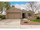 Charming single-story home with a well-maintained yard and a two-car garage at 4266 S Winter Ln, Gilbert, AZ 85297