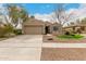 Charming single-story home with a well-maintained yard and a two-car garage at 4266 S Winter Ln, Gilbert, AZ 85297