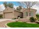 Charming single-story home with a well-maintained yard and a two-car garage at 4266 S Winter Ln, Gilbert, AZ 85297